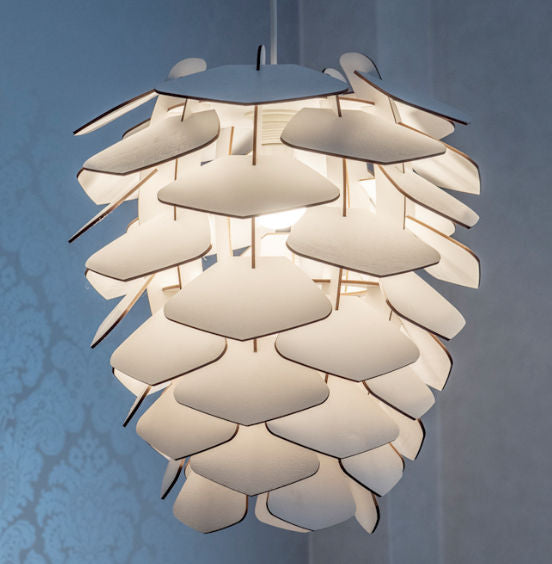 A ceiling lamp with a nature-inspired design, resembling a pine cone, made from thin birch veneer with light passing through it.
