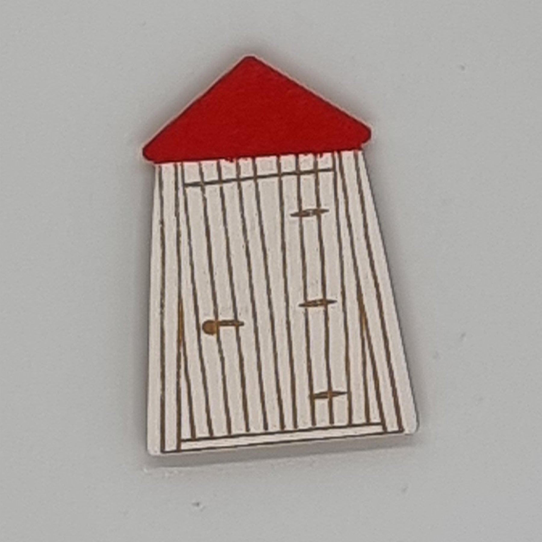 A handcrafted magnet in the shape of a bathing room with vertical white lines and a red roof.