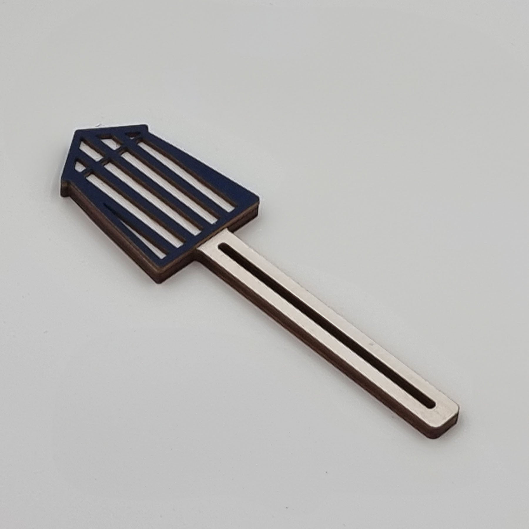 Wooden tube squeezer for mustard or other tubes, handcrafted from laser-cut birch plywood with a blue-painted top in the shape of a striped beach cabin